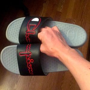 never worn champion slides. grey and black with red champion.